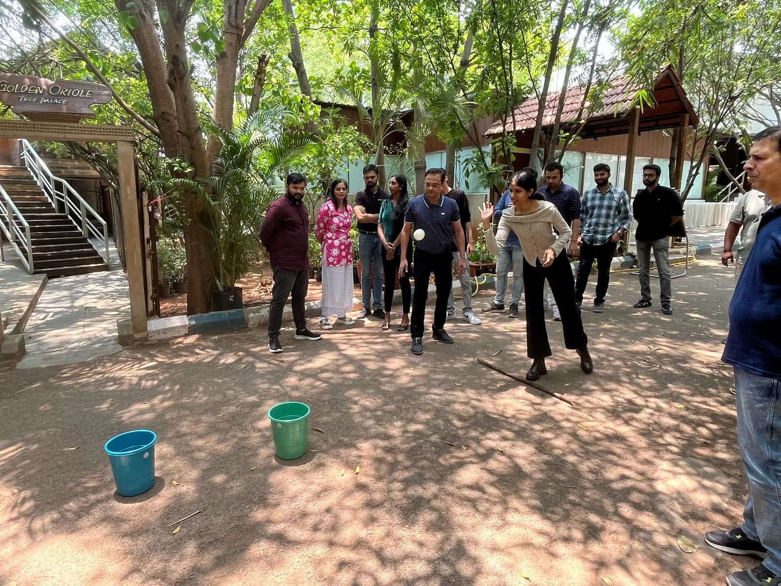 FusionFoundry team playing an outdoor team game under the trees