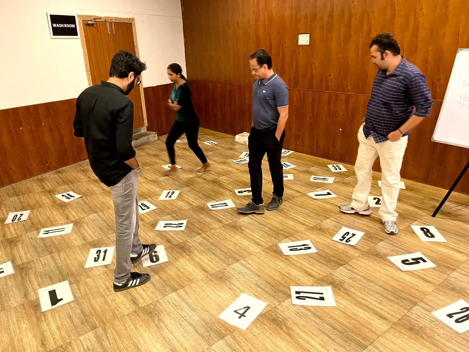 FusionFoundry team taking part in a floor-based problem-solving activity